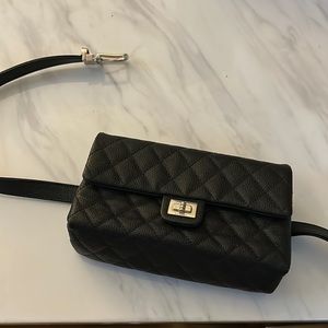 Black caviar quilted uniform waist bag with silver hardware.